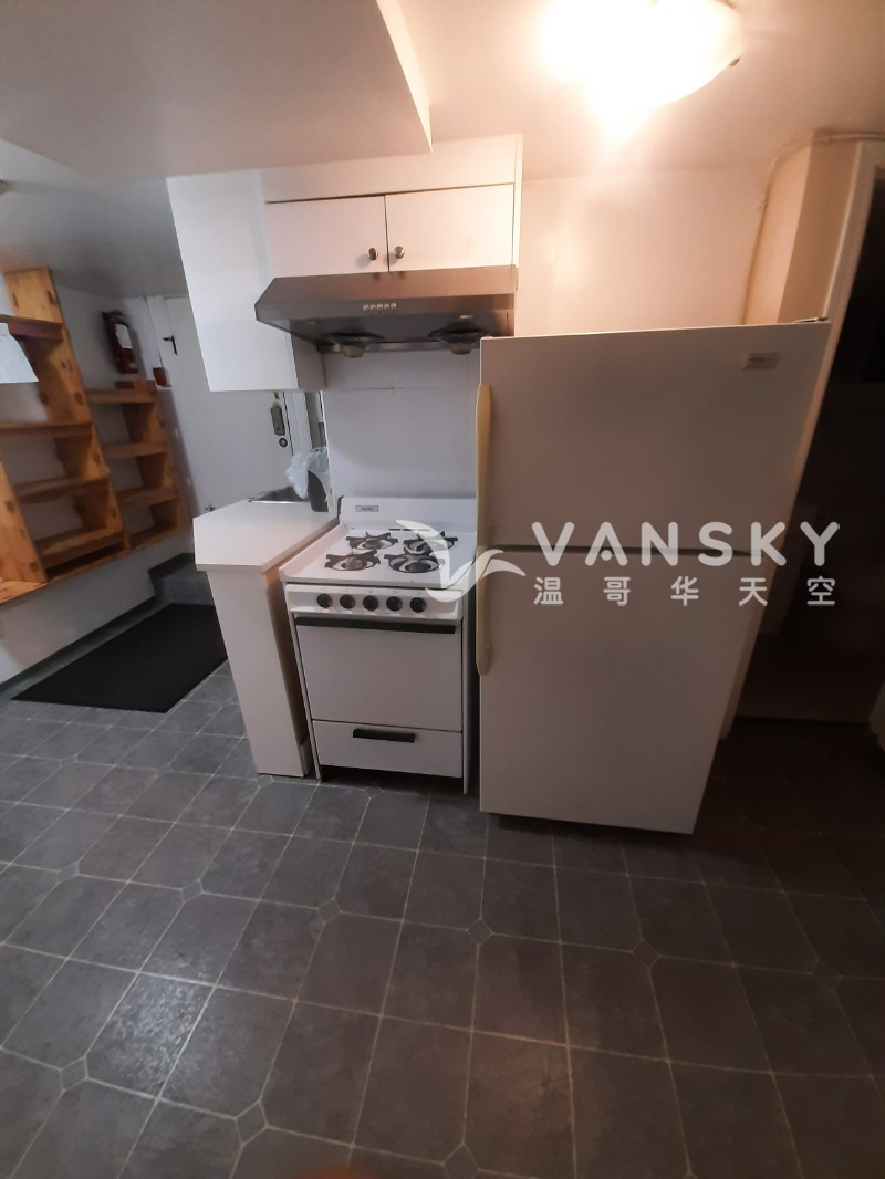 260110124405_ground kitchen refrigerator and stove.jpg